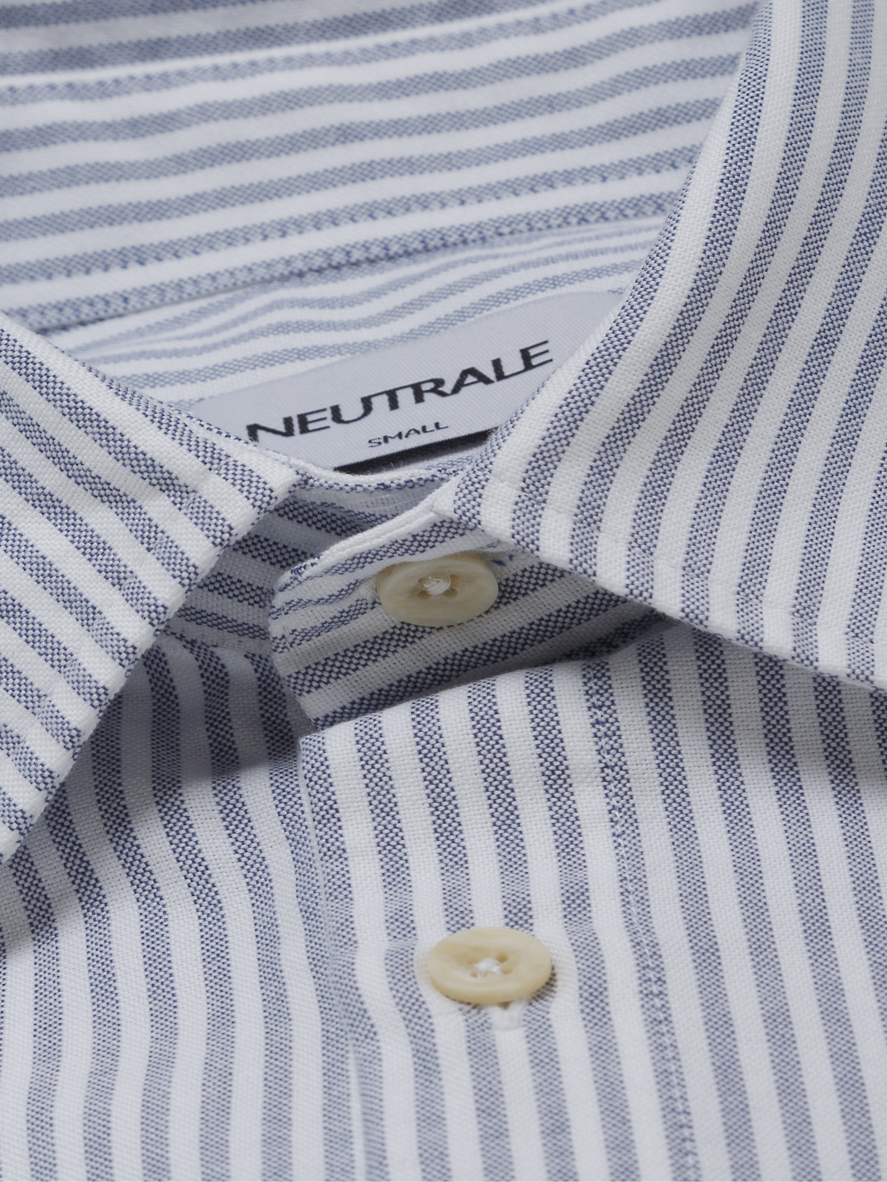 Oxford striped button down shirt with a classic button-down front and round hem. Crafted from 100% certified organic cotton.